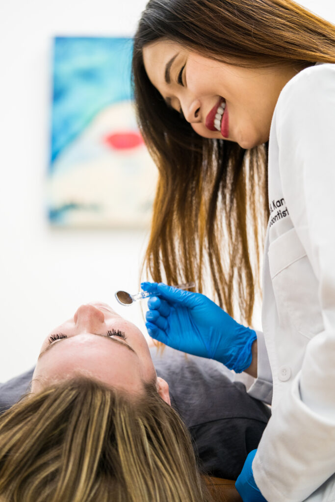 Dr. Kang Orthodontist in Frisco tx performing orthodontic consultation